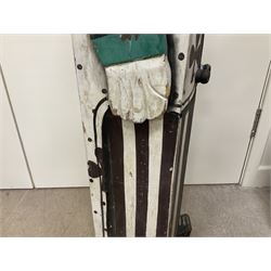 Folk art circus clown cabinet, the the two hinged doors with bow tie decoration opening to reveal fitted shelved interior, the body painted with polka dots and spades, H121cm