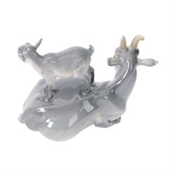 Five Royal Copenhagen figures, including Mare and Foal no.698, Goat and Kid no. 4744, Fox and Cubs no.1788