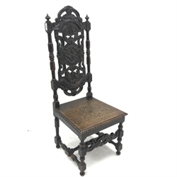 19th century heavily carved oak hall chair, solid seat, baluster supports joined by stretchers, W51cm
