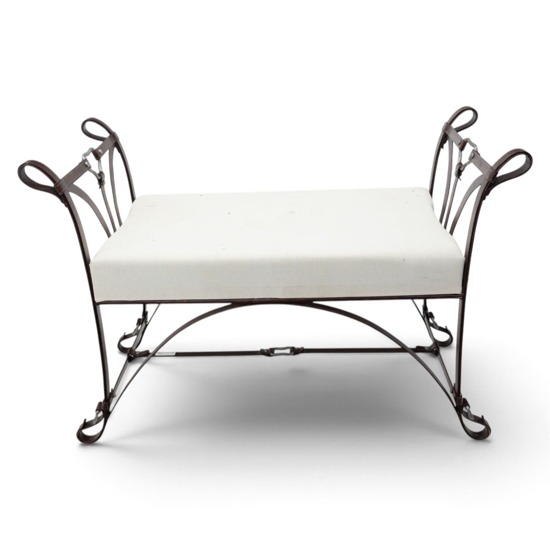 And So To Bed - 'Handel' wrought iron window seat, the rectangular upholstered seat enclosed by scrolling and arched ends with shaped uprights, on scrolling supports united by curved stretchers