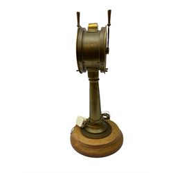 Early 20th century, illuminating brass ship's telegraph by Chadburns of Liverpool and London, on a circular wooden plinth, H55cm