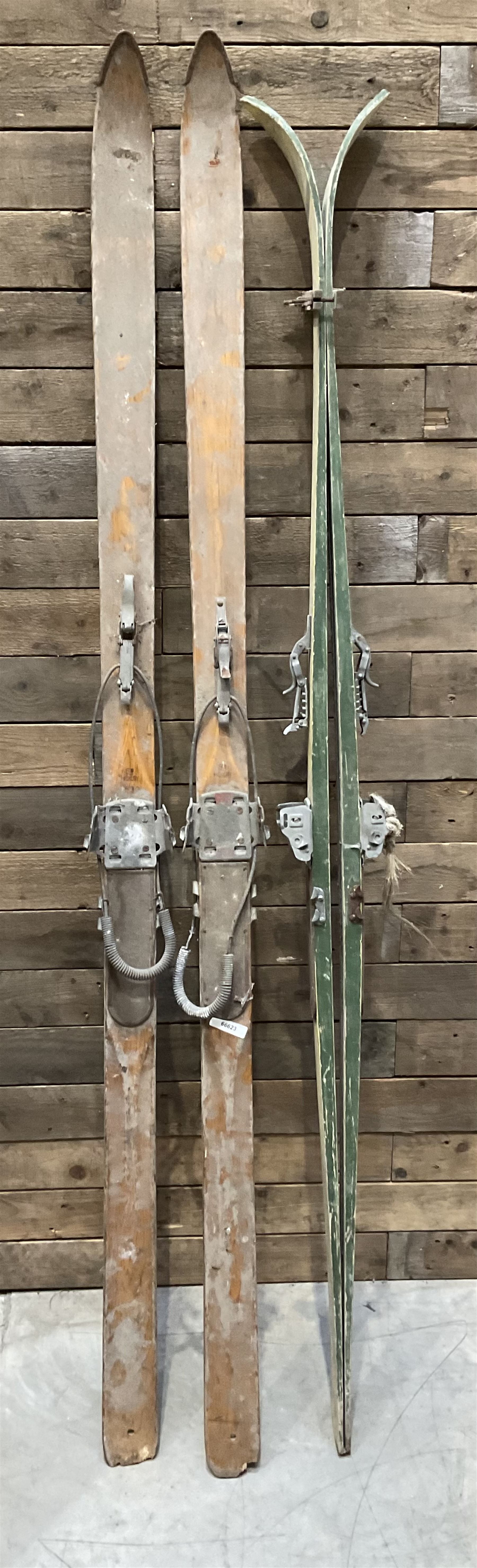 Two pairs of vintage skis, L207cm and 197cm