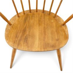 Ercol - pair of 'Cowhorn' elm carver chairs, curved back raised on nine stretchers, elm dished seats, raised on tapering supports
