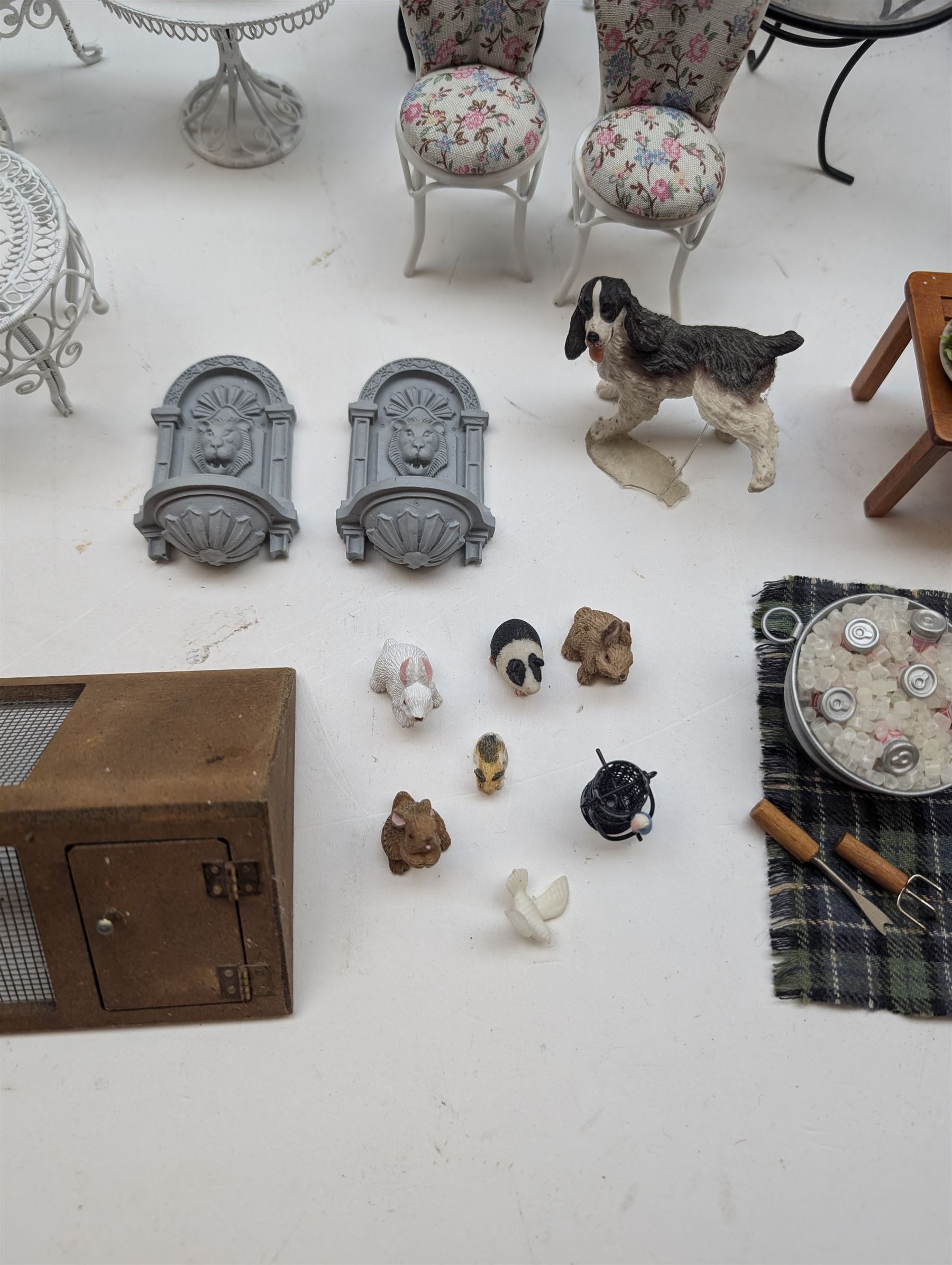 1:12 scale dolls house conservatory and garden accessories, including white wooden glazed conservatory on a stone effect base, black and white metal garden seating, barbecue, plant shelves, parasol, barbeque accessories, large planters, rabbit hutch, animals, chimenea, etc