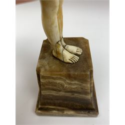 Demetre Chiparus (1886-1947): Innocence, a gilt bronze and ivory figure, circa 1925, standing in contemplative post with hands clasped, upon onyx plinth, signed to base, H24.4cm