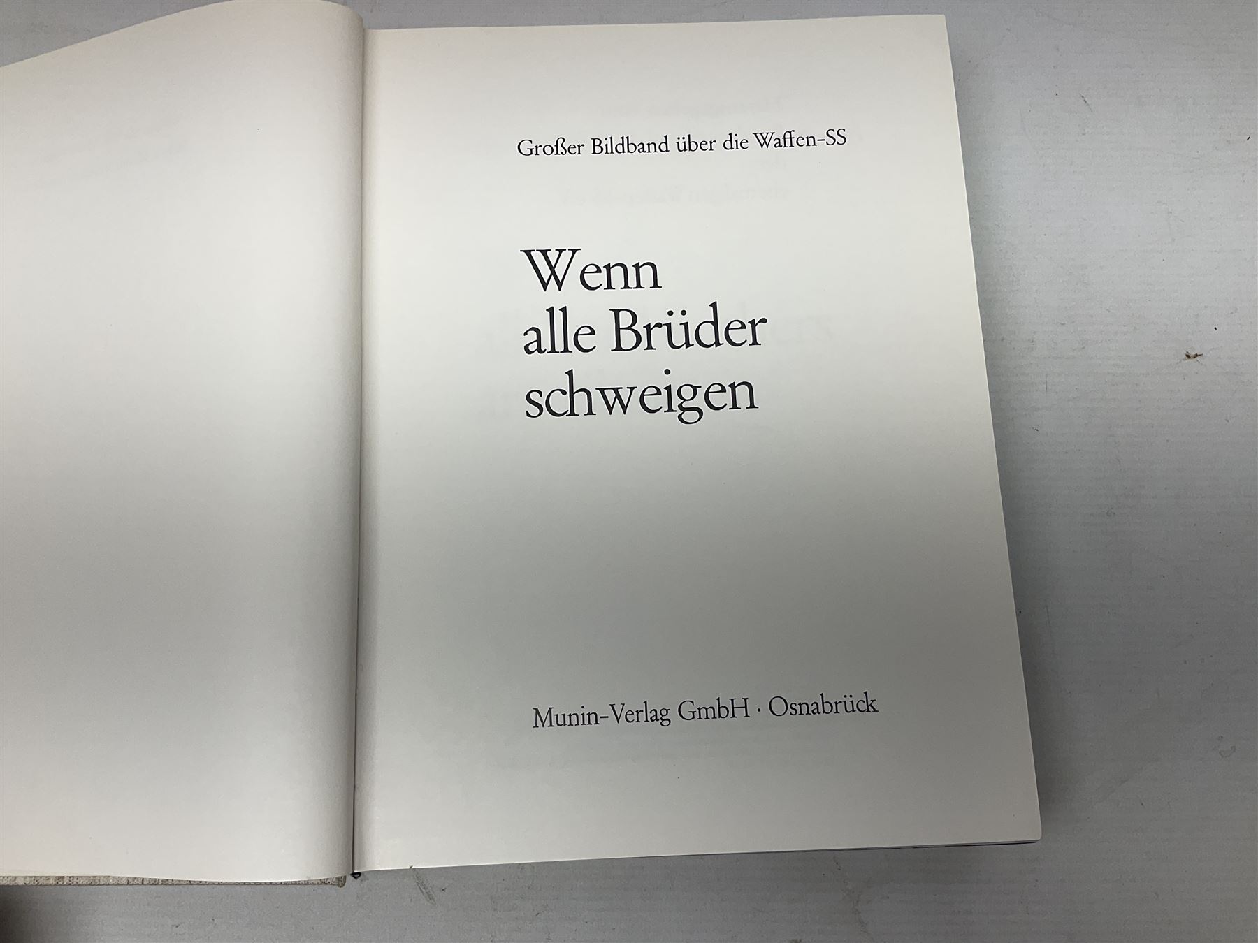 Adolf Hitler, Bilder aus dem Leben des Fuhrers [Pictures from the Life of the Fuhrer], Herausgegeben vom Cigaretten / Bilderdienst, Hamburg / Bahrenfeld, 1936, an album of two hundred tipped-in cards bearing photographs by Heinrich Hoffman, originally collected with cigarettes, 31 cm x 24 cm; together with a Waffen-SS book 'Wenn alle Bruder schweigen'; Hamburg 1939-1945; and two other booklets