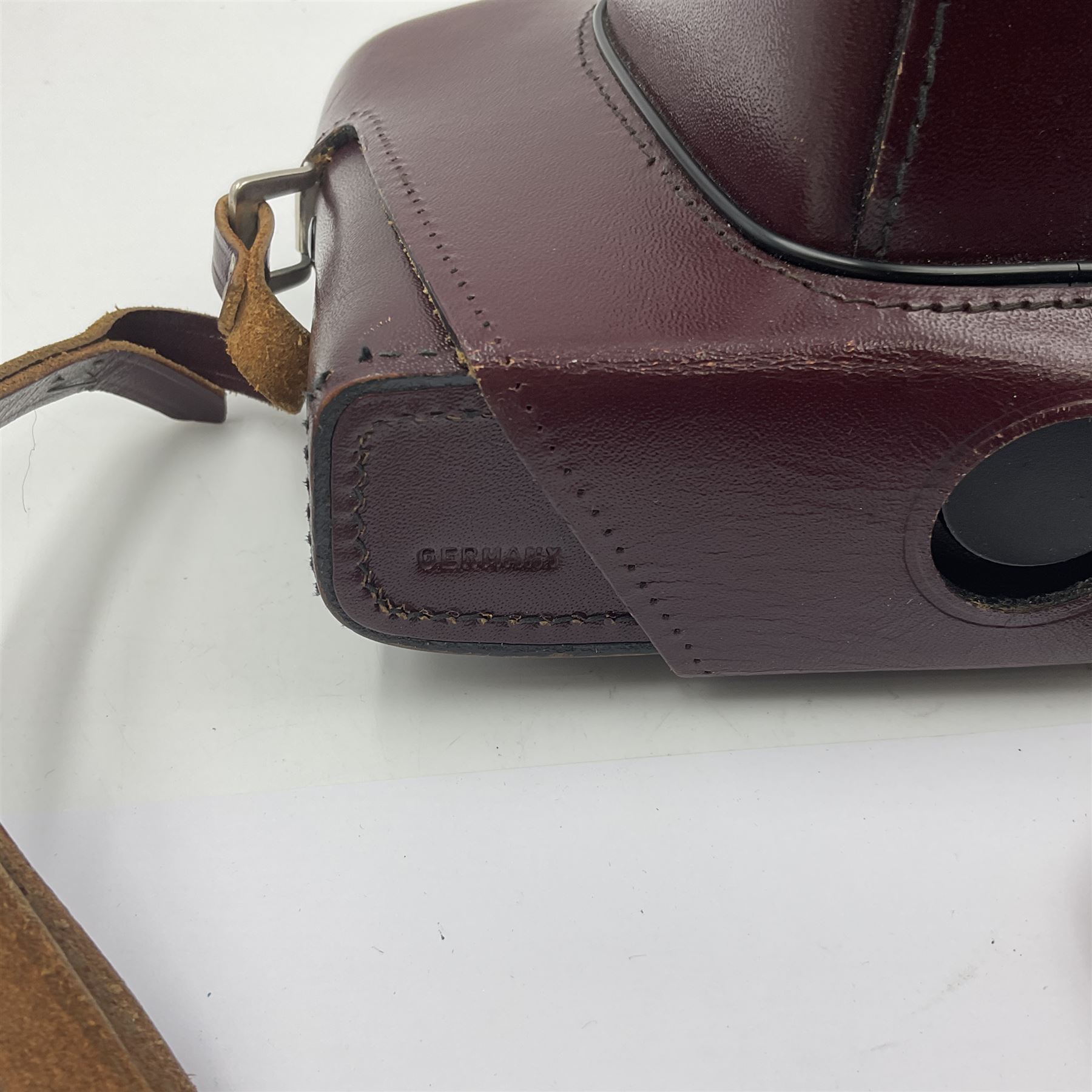 Leitz Leicaflex SL2 camera body, serial no.1387046, with 'Summicron-R 1:2/50 Leitz Wetzlar' lens, serial no. 2273397, within a leather Leitz lens hood 