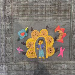Guatemalan hand stitched wall hanging panel, naively embroidered with figures, animals, and flowers in a bright pallet, upon a dark green ground, approximately H230cm W115cm