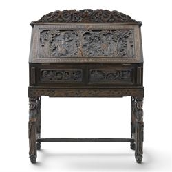 Early 20th century Chinese export carved hardwood writing bureau, the sloped fall front de...