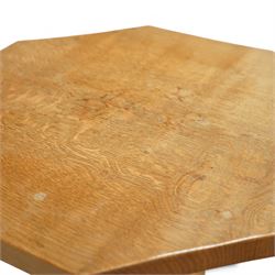 Mouseman - octagonal occasional table, raised on a cruciform base with arched supports, carved with signature mouse to one side, by the workshop of Robert Thompson, Kilburn