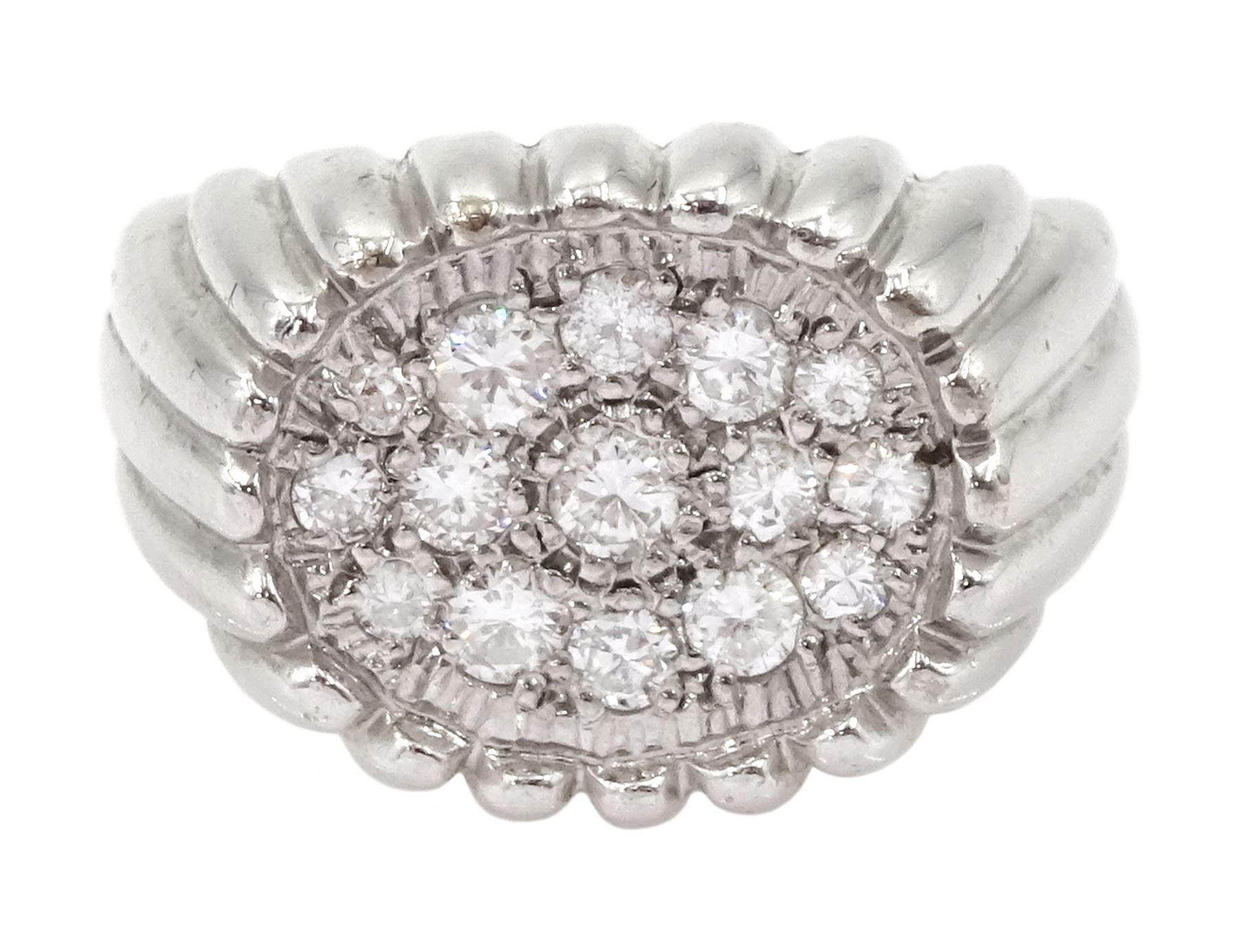 White gold diamond ring, fifteen pave set round brilliant cut diamonds, in an oval setting, stamped 18ct, total diamond weight approx 0.70 carat