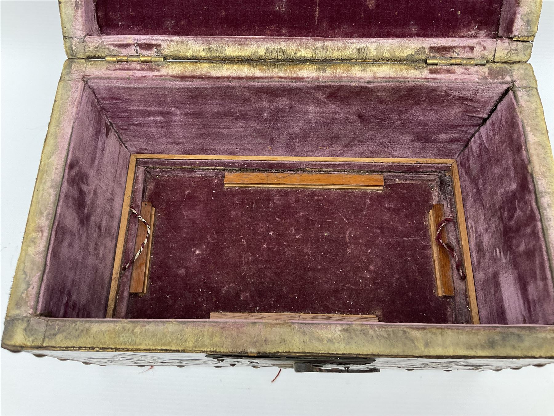 20th century box, decorated in faux leather with the royal coat of arms and GR 1719 to hinged cover, with fleur-de-lis, lion, crown and rose motifs throughout and studs to all edges, opening to reveal a purple velvet interior containing three removable wooden trays, H18.5cm