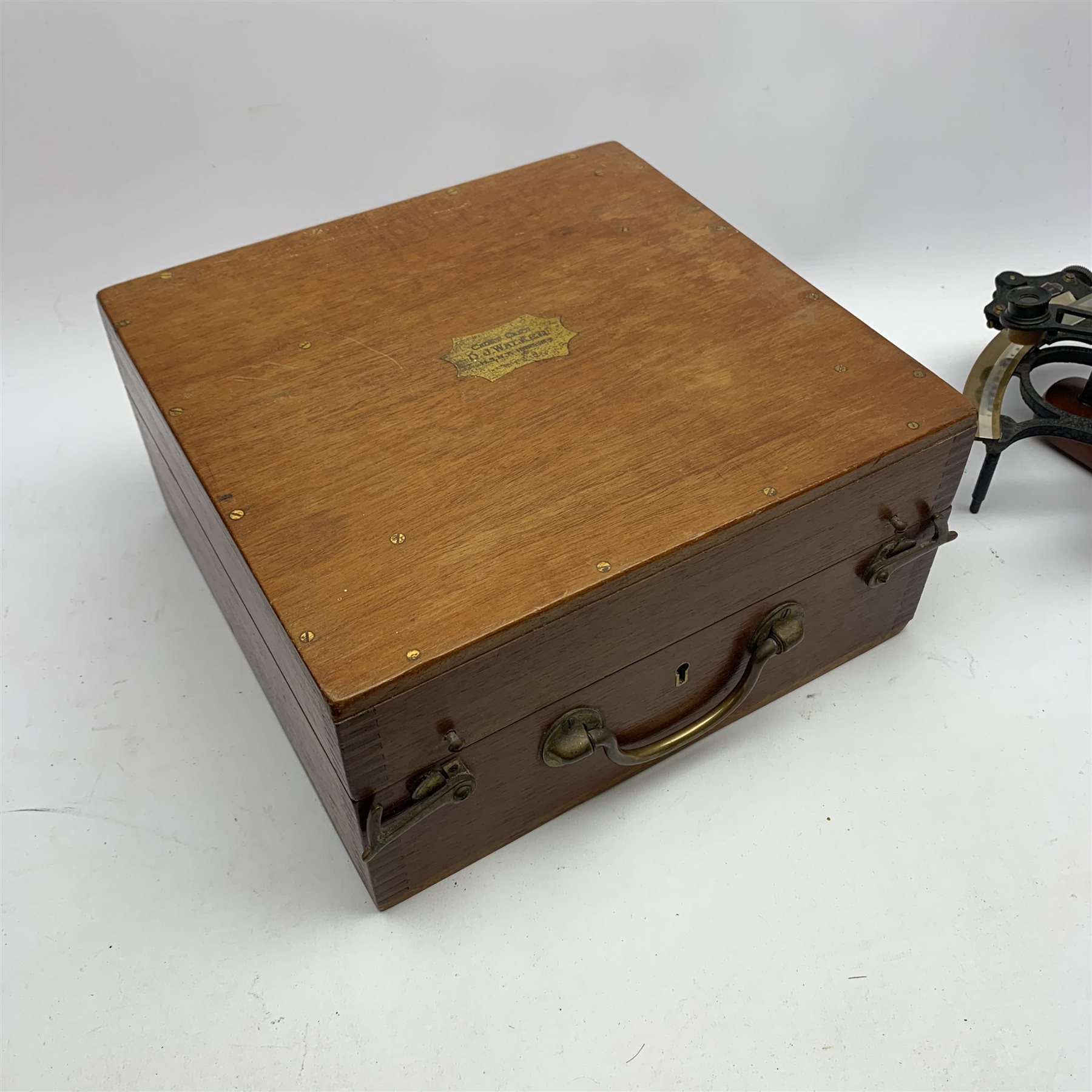 Heath & Co 'Hezzanith' sextant, pattern 491.V., with black crackled framework, brass arc with silvered scale, endless tangent screw and automatic clamp, bears label 'Cooke Hull', serial no.JJ375, in fitted mahogany box with additional lenses and Certificate of Examination dated October 1964. Inset plaque to box lid inscribed 'Cadet Capt. D.J. Walker H.S.N.T. 1983 - 84'. Provenance: Captain Walker was later in command of the North Sea Ferries ship Norland and the vendor is his widow.