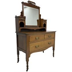 Edwardian walnut dressing table chest, raised back fitted with bevelled swing mirror and trinket drawers, above two short and one long drawer, raised on turned supports 