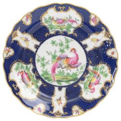 Late 19th/early 20th century Samson, Paris porcelain vase and cover, of baluster form, decorated after Worcester with gilt C scroll surround reserves painted with exotic birds, and insects and butterflies, upon a blue scale ground, H25cm, together two similarly decorated late 19th/early 20th century Samson, Paris cabinet plates, one example with spurious fret mark beneath, D22cm