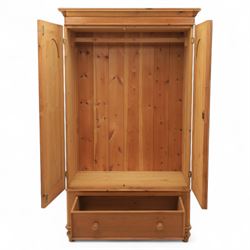 Two contemporary traditional-style wardrobes, projecting plain cornice above two arched moulded panel doors, above a full-width drawer fitted with turned wooden handles, raised on turned bun feet