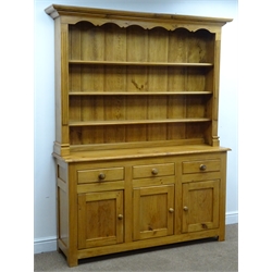  Polished pine dresser, projecting cornice, three shelf back above three drawers and cupboards, W160cm, H198cm, D40cm  