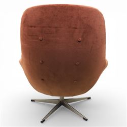 Pair of mid 20th century brown velvet swivel lounge chairs and matching footstool, the shaped and padded back with buttoned segmented cushion over conforming seat cushion, flared armrests and moulded sides, raised on a five point metal swivel base, the footstool en suite with buttoned cushion and matching metal base