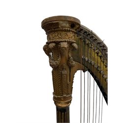 J. Erat. Wardour Street, London, Soho - Regency parcel-gilt and rosewood finish pedal harp, forty-three strings and five swell doors, the fluted pillar decorated with rams head capital, floral festoons, anthemion motifs and sarcophagi, the base decorated with pharaonic motifs and fitted with eight brass pedals, on carved paw feet, brass signature plate to top inscribed 'J. Erat. Wardour Street, London, Soho, 606'