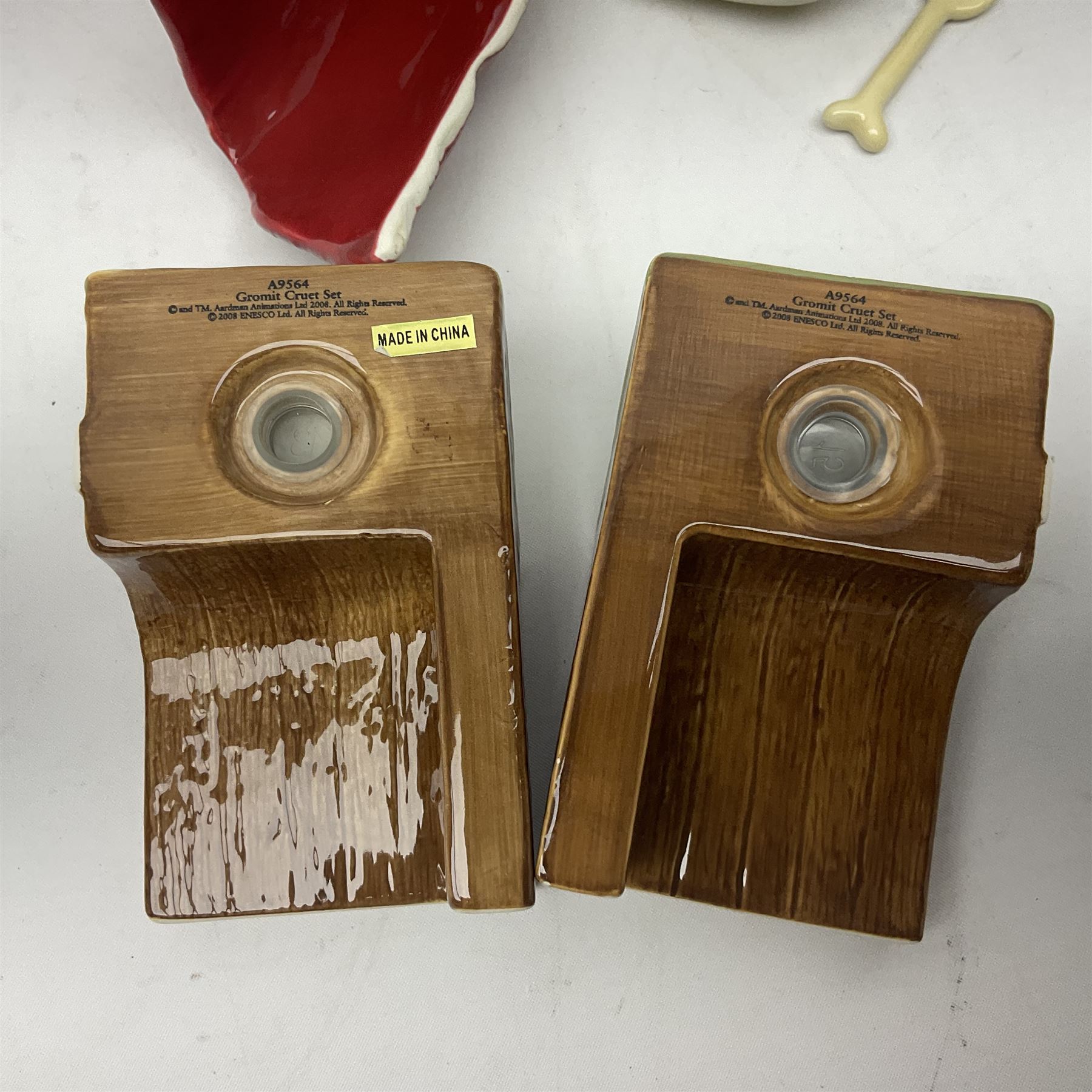 Border Fine Arts Shaun The Sheep Tractor Train and musical figure, together with a Wallace and Gromit photograph frame and a Gromit cruet sett, three in original boxes  