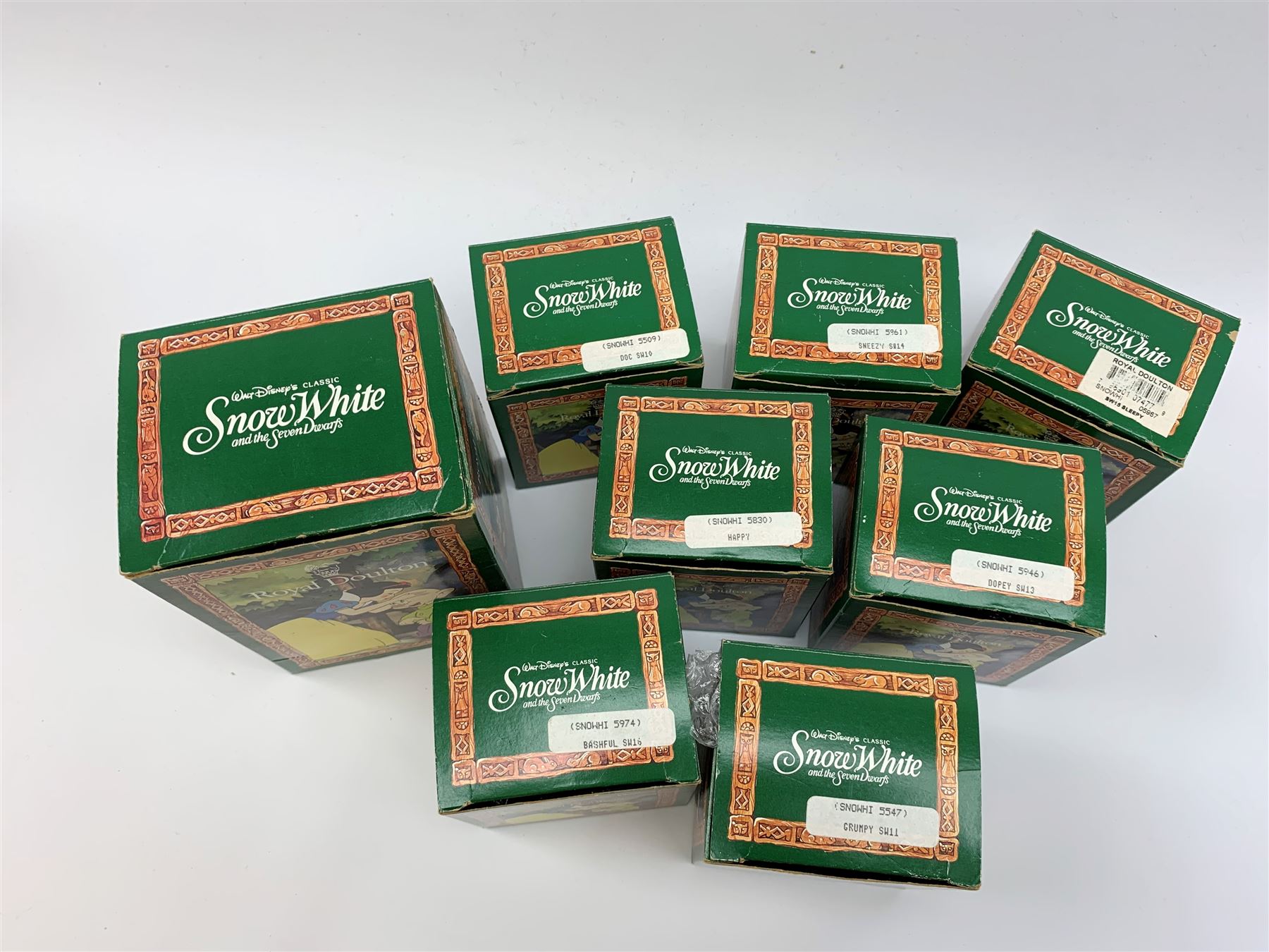 Royal Doulton Snow White and the Seven Dwarfs figurines, each with box. (8). 