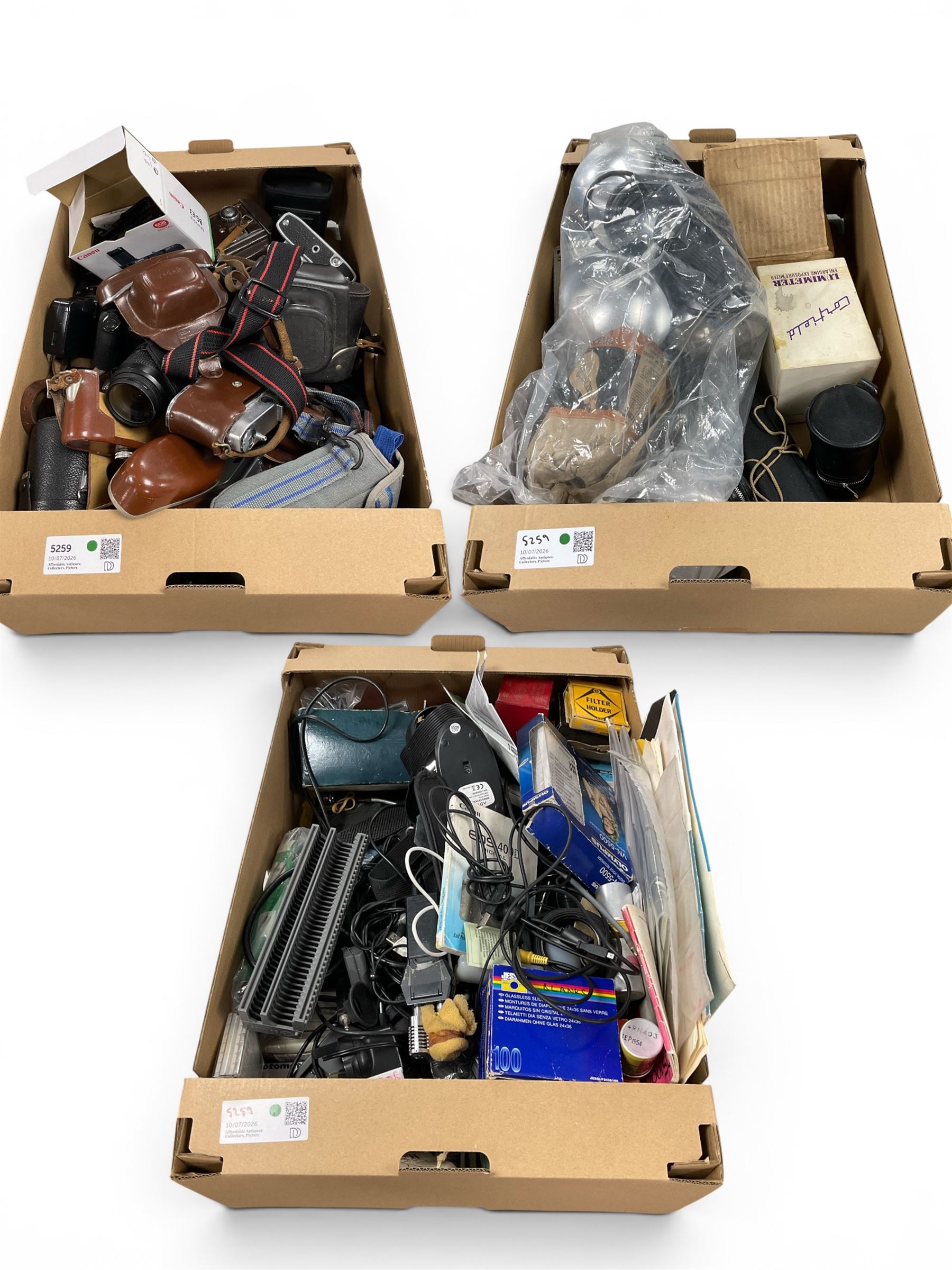 Collection of cameras and camera accessories, including Canon Sure Shot AF-7, Retinette 1A and Agfa Optima II