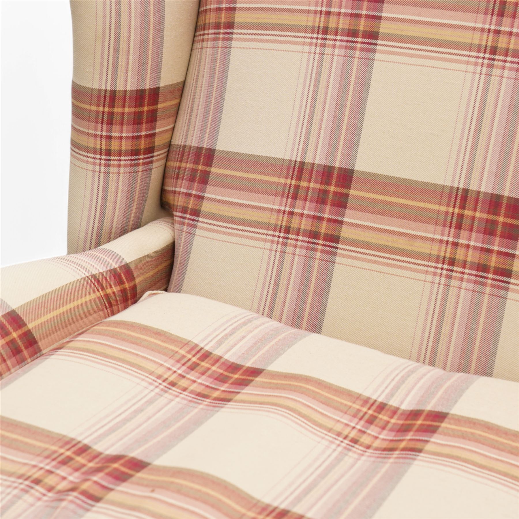 Laura Ashley - hardwood-framed wingback reclining armchair upholstered in checkered fabric, on turned and fluted front feet with brass cups and castors 