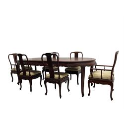 Mid to late 20th century Chinese hardwood extending dining table, two additional leaves, shaped apron carved with foliate scrolls, leaf carved cabriole supports (W246cm, H78cm, D117cm), and set six (4+2) dining chairs with shaped cresting rails over carved splats