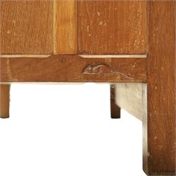 Mouseman - early-to-mid-20th century panelled and adzed double wardrobe, the arcade carved cresting rail over two panelled doors, with wrought metal hinges and latch, deep relief carved mouse signature, the interior fitted with hanging rail, by the workshop of Robert Thompson of Kilburn
