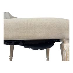 Pair of contemporary hardwood corner chairs, upholstered in broad alternating bands of neutral-toned fabric, each with two knotted rope buttons to the backrest, the whole raised on turned and lightly whitewashed supports terminating in castors