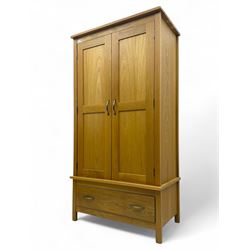 Light oak double wardrobe, hanging rail with single drawer on square legs 