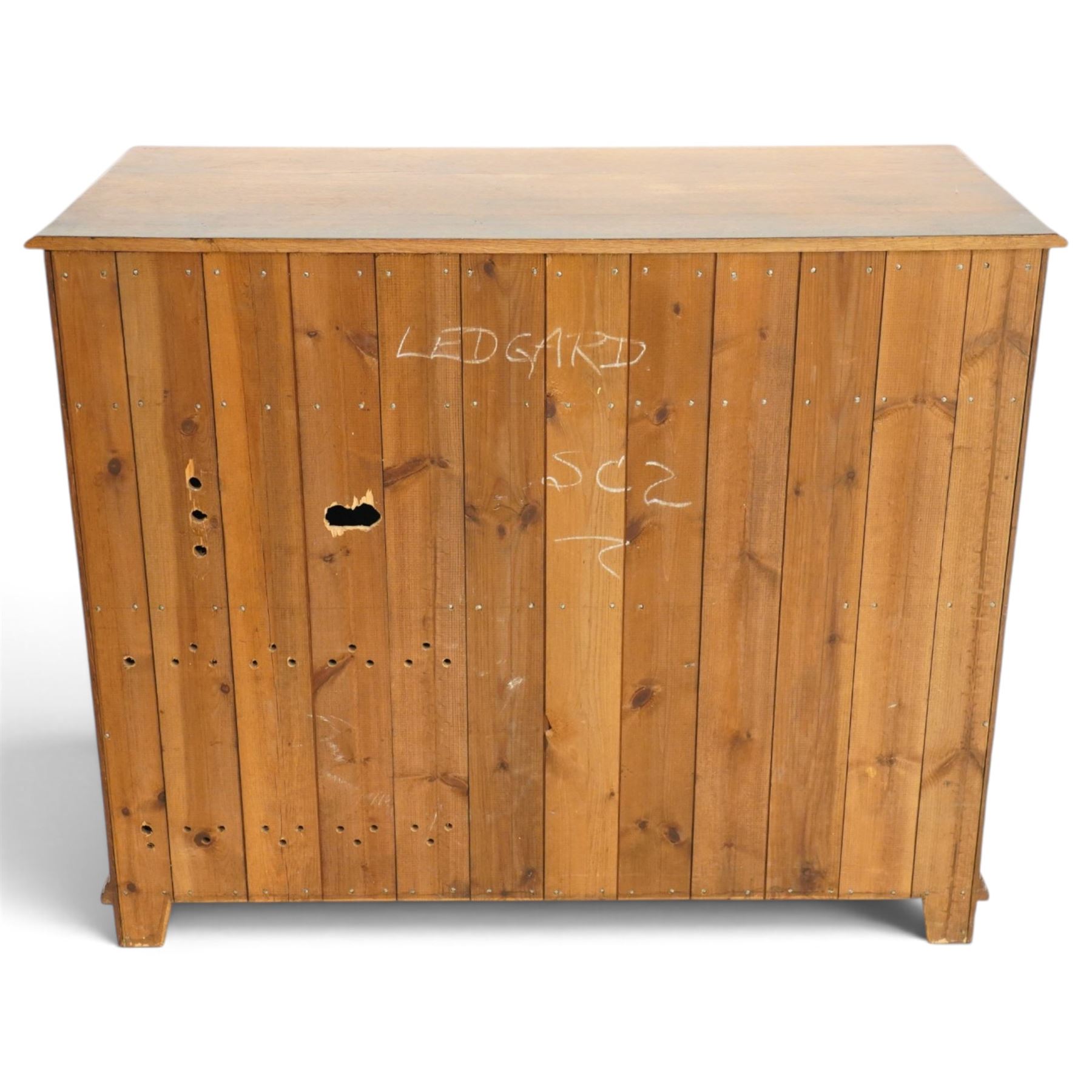 18th century style oak dresser base, rectangular moulded top over two frieze drawers with brass handles, twin panelled cupboard doors below with pierced brass escutcheons, on stile feet
