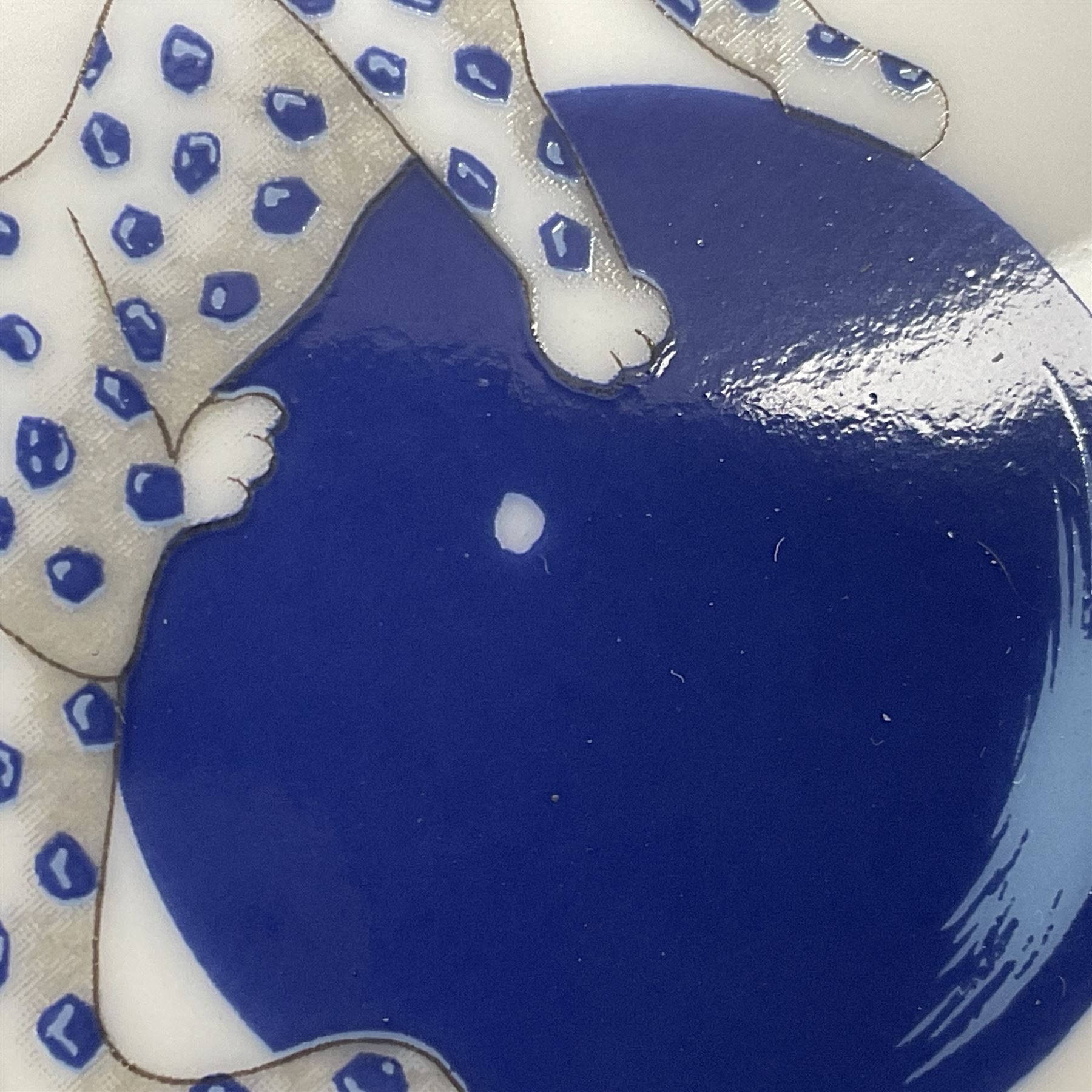 Limoges for Cartier, ceramic trinket dish, of rectangular form with rounded corners, decorated to centre with leopard upon a blue ball, with blue and gilt rim, with printed mark beneath, in original box, H15.5cm, W21cm