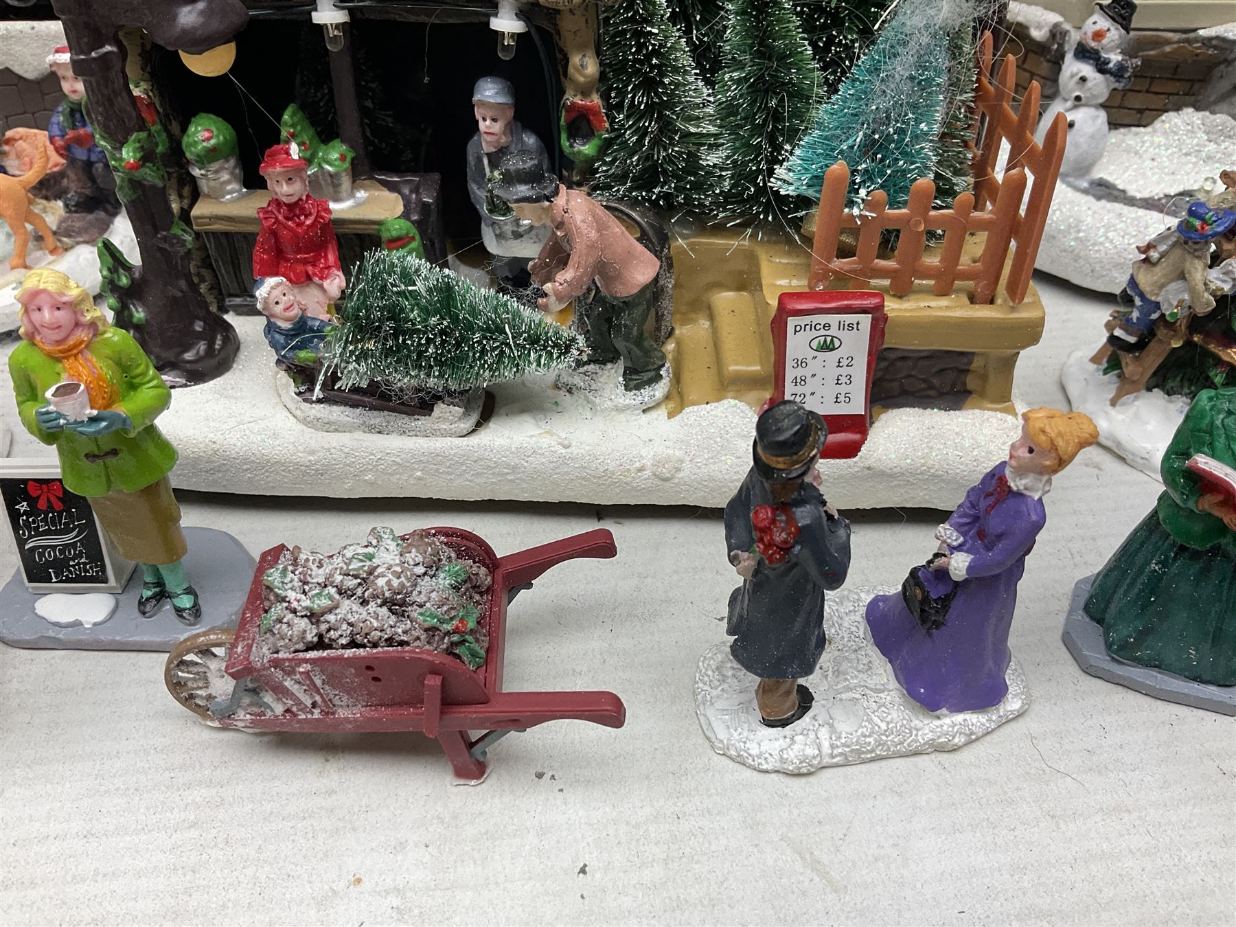 Christmas decorations; Premier LED Christmas Village scene with moving train, together with three Lumineo christmas scenes, and other similar 