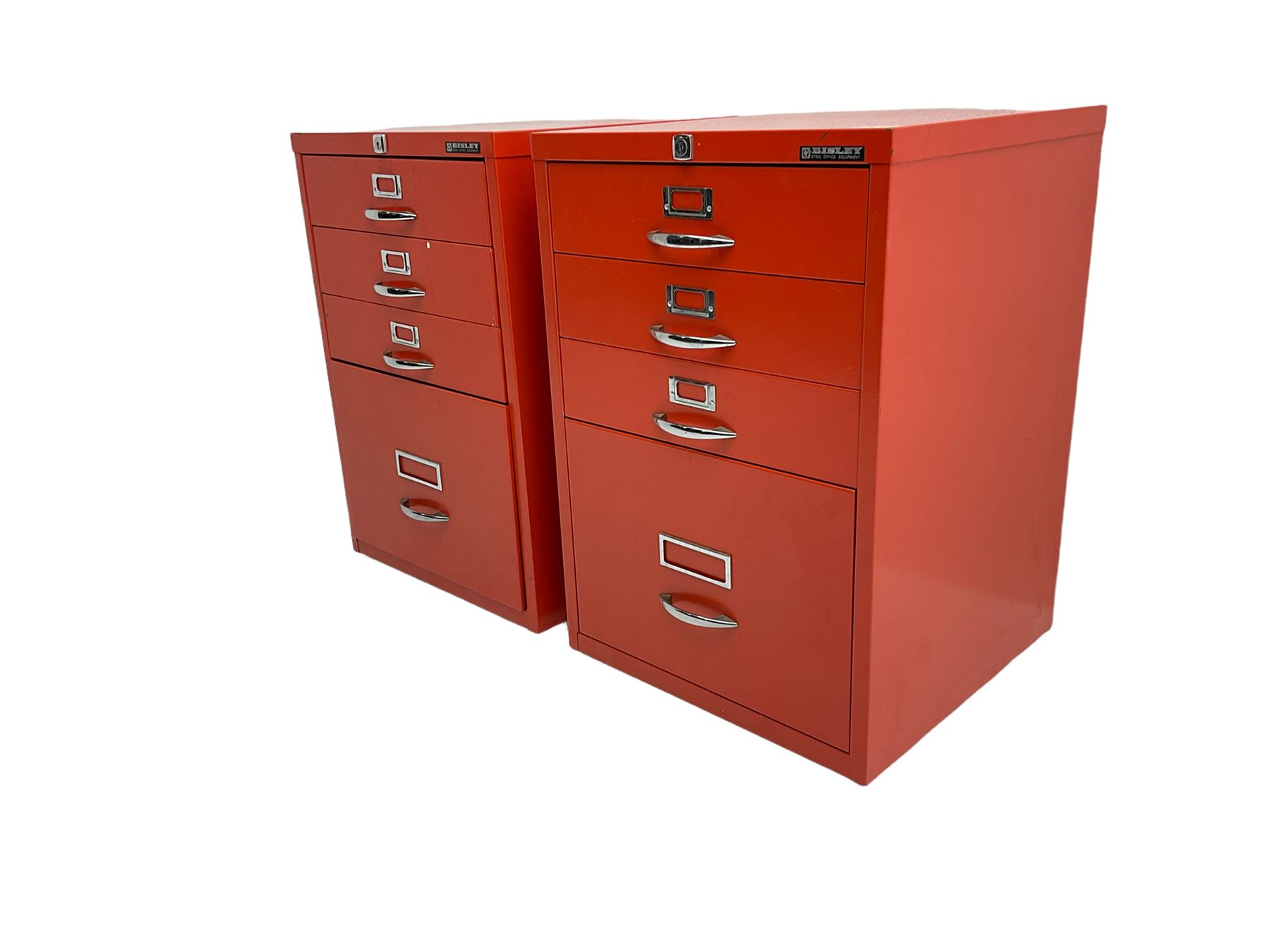 Two red finish 'Bisley' four drawer filing cabinet
