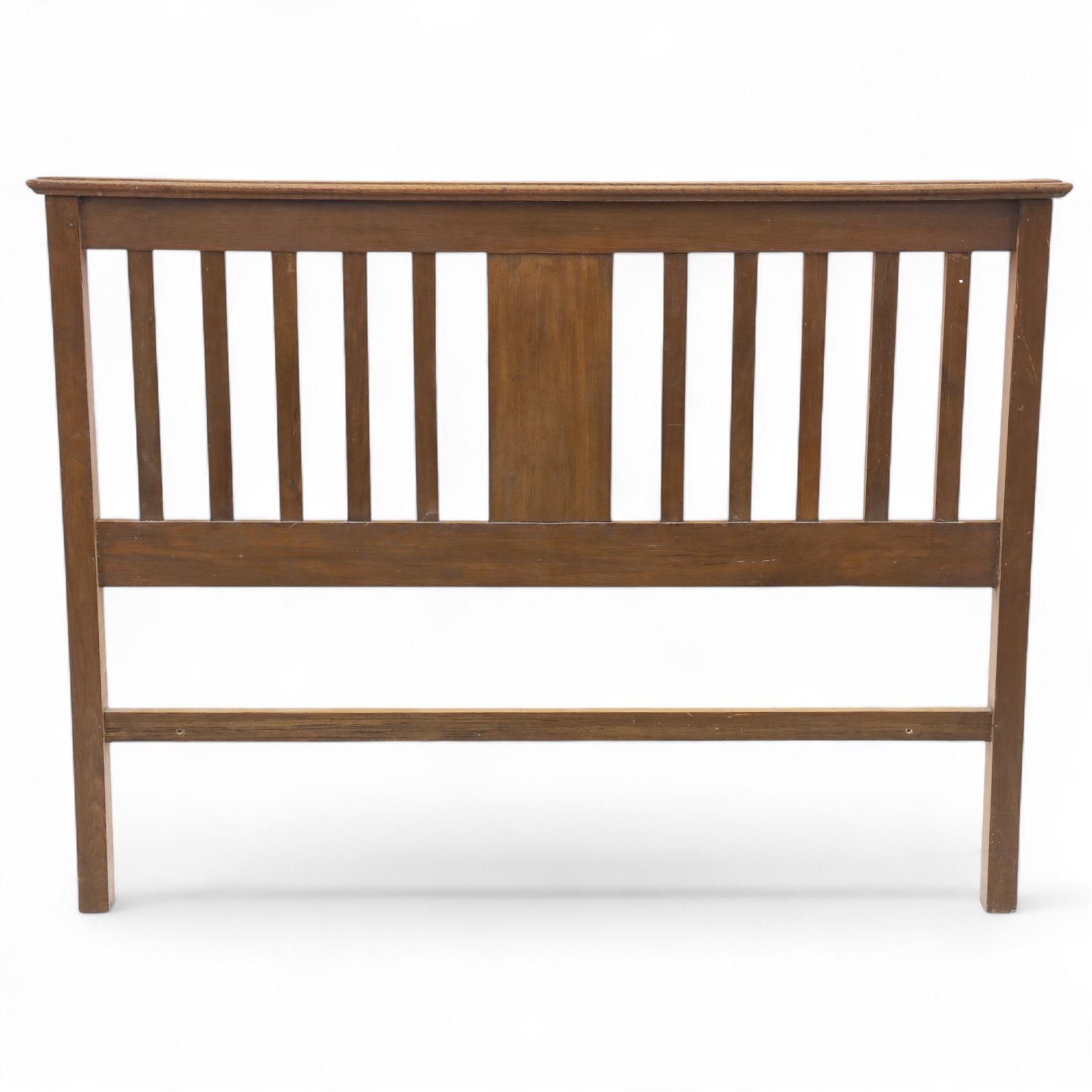 Art Nouveau oak double bed headboard, rectangular form with vertical slats centred by a carved stylised floral roundel