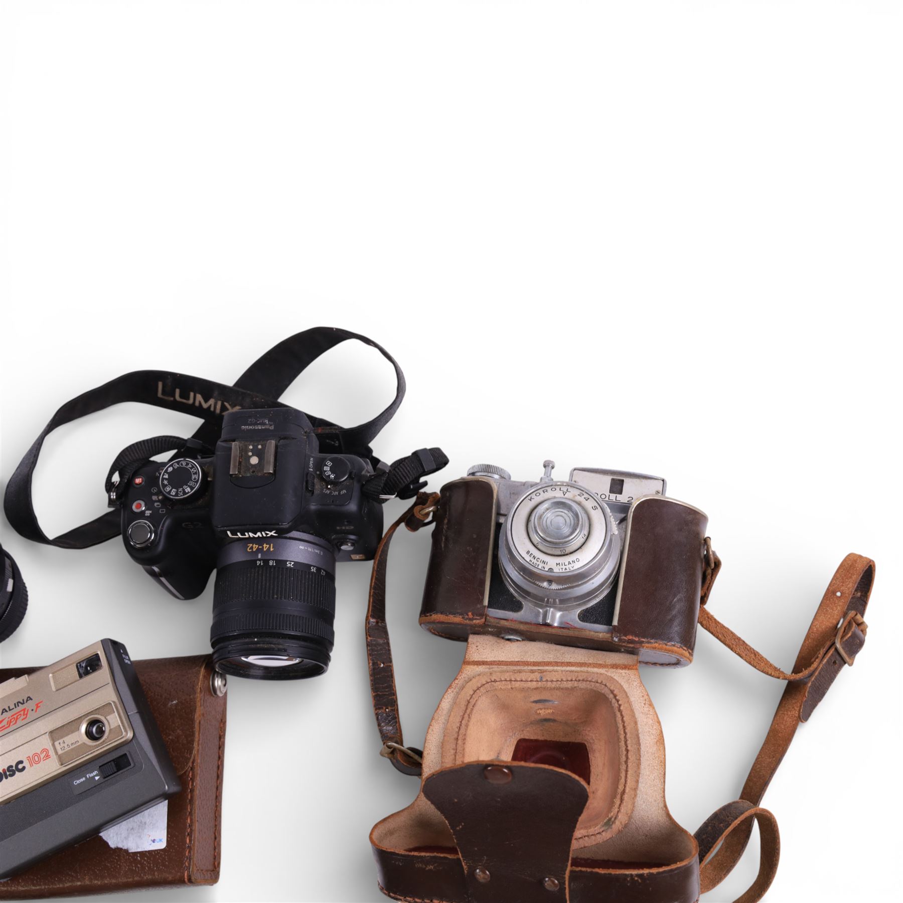 Collection of cameras, lenses and accessories, including Panasonic Lumix DMC-G2, Koroll 24, Coronet folding camera, Halina Zippy F and Vivitar Series 1 lens