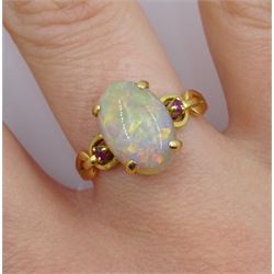 18ct gold three stone oval opal and ruby ring