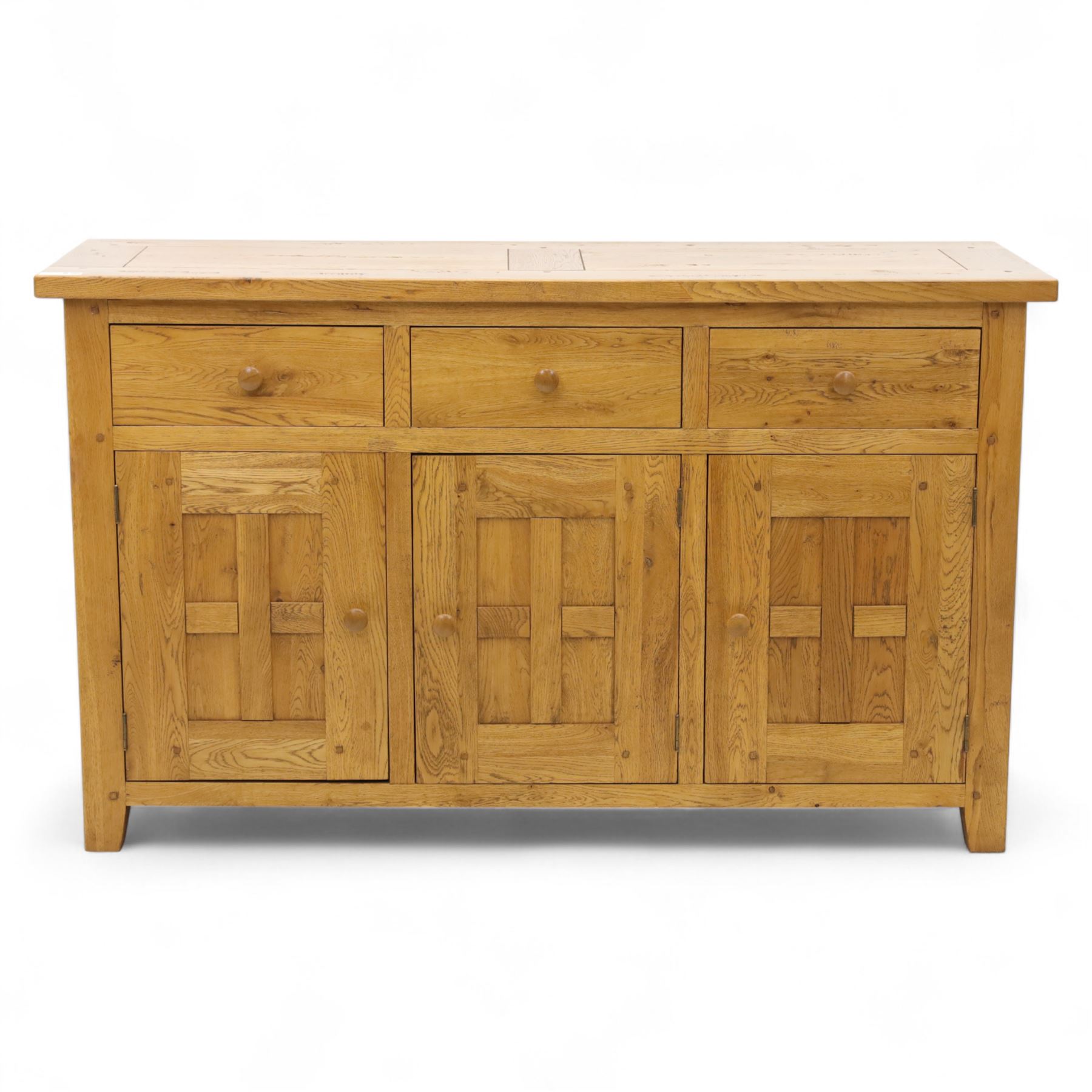 Contemporary solid oak sideboard, rectangular plank top above three drawers and three panelled cupboard doors, fitted with wooden knop handles