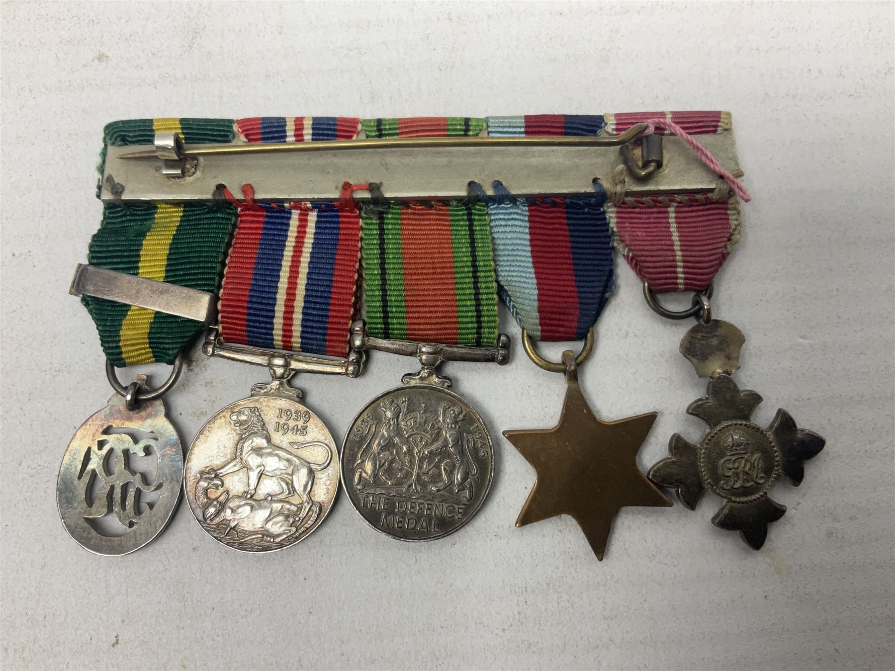 Three miniature groups of five medals - OBE Military group with WW1 trio and Italy Order of Saints Maurice & Lazarus Knights Cross; MBE Military group with WW2 trio and Territorial Efficiency Decoration; and WW2 trio, General Service Medal 1918-62 with Brunei and Arabian Peninsula clasps and GSM 1962 with Borneo clasp; all with ribbons on pinned wearing bars (3)