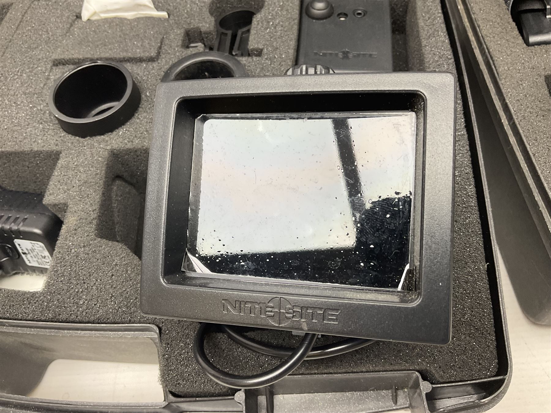 Two Nite-Site add-on kits in hard plastic carrying cases; one with charger