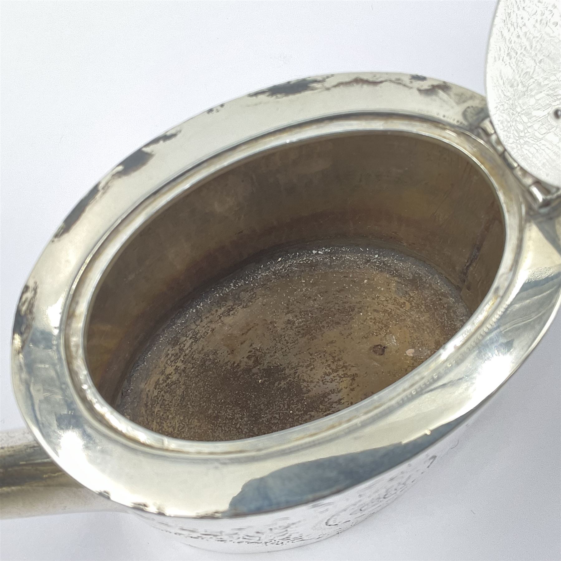 George III silver bachelors teapot, of oval form with wooden scroll handle and finial, the body chased with armorial crest and ribbon swag and foliate detail, hallmarked Samuel Godbehere & Edward Wigan, London 1793, including handle H9cm