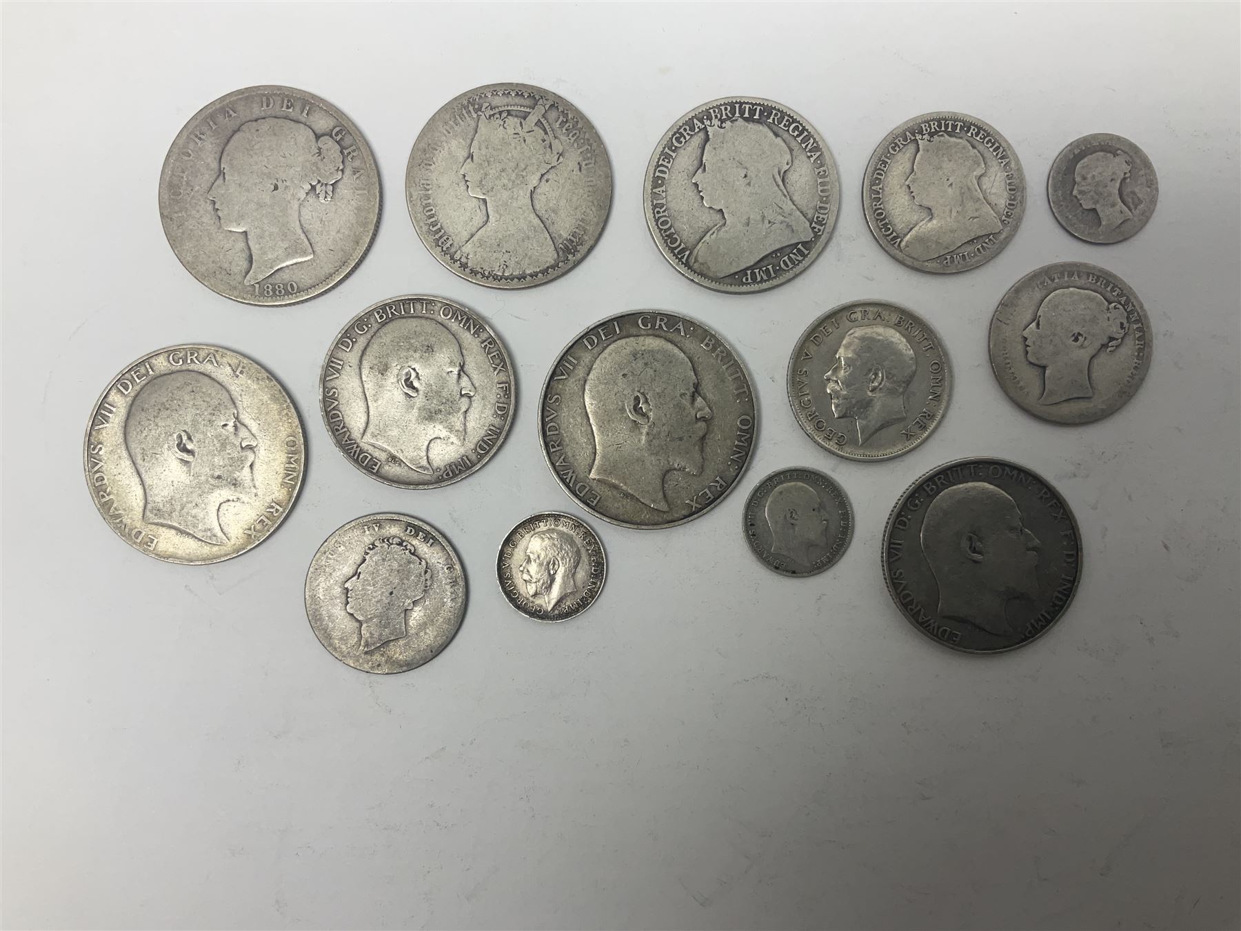 Approximately 110 grams of Great British pre-1920 silver coins, including Queen Victoria 1872 shilling, gothic florin, 1880 half crown, King Edward VII 1907 standing Britannia florin, 1906 and 1907 half crowns etc. 