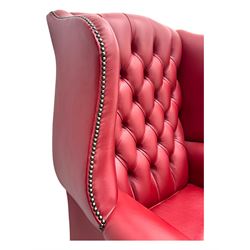 Kingsgate - contemporary 'Suffolk' wingback armchair and matching stool, upholstered in red leather with deep button tufting and brass stud trim, raised on square section supports 