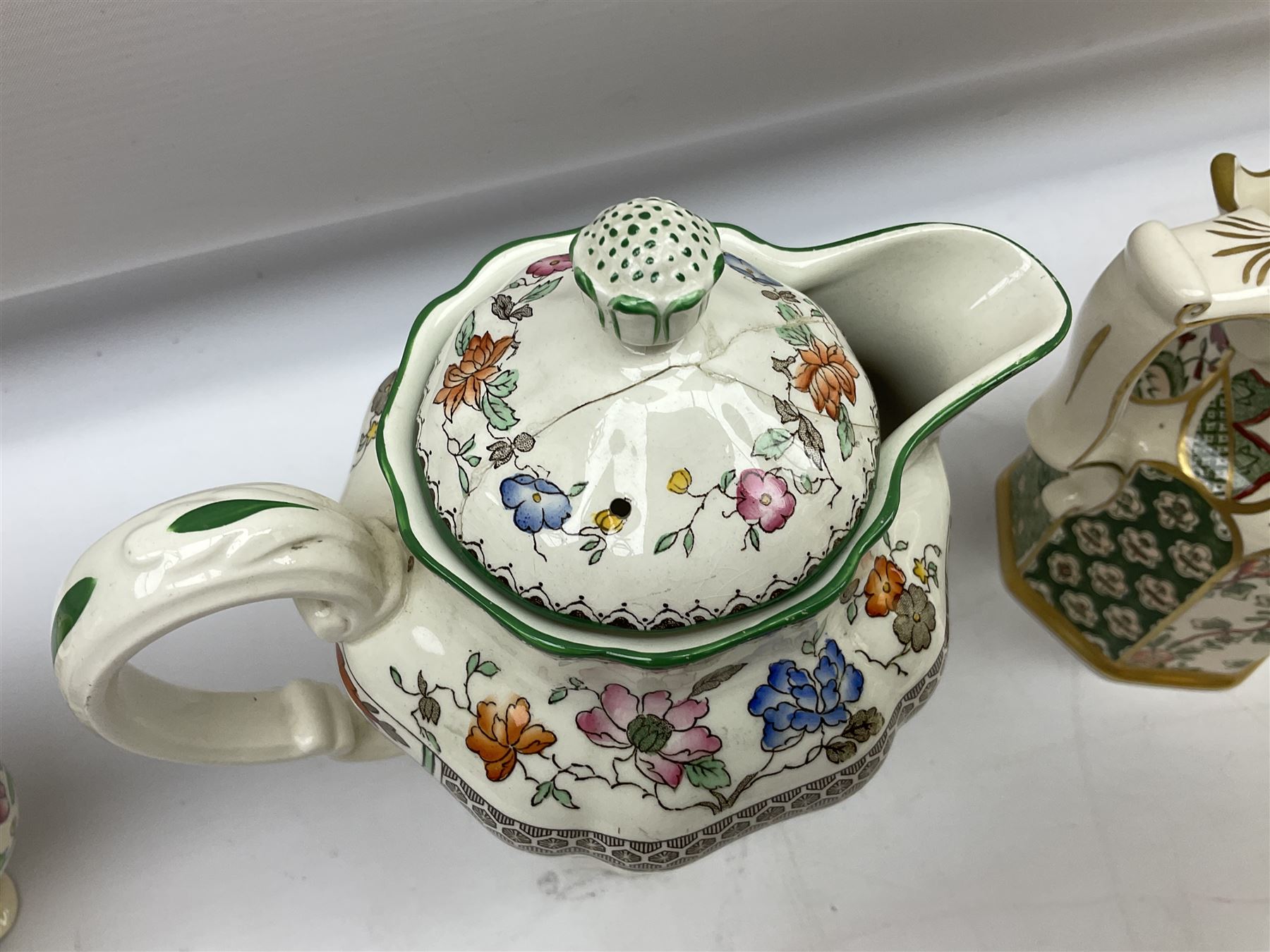 Group of ceramics to include Art Deco examples, Arthur Wood twin handled vase decorated in the Garden Wall pattern, Art Deco style Coalport twin handled lidded sucrier and saucer, Mason's Applique jug (scratch through mark), Royal Doulton Minden bowl and jug, Copeland Spode Royal Jasmine jug, Crown Devon, etc