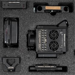 RED Epic-W Helium 8K camera body serial no. 13024E6A9, with RED EVF, three RED Mini Mag 512GB cards, one 480 Mini Mag card and reader, two RED V-Mount batteries and charger, RED top handle, Wooden Camera Easy Top top plate and one other top plate, various accessory cables, Wooden Camera bridge plate for 19mm studio rods, 12 inch Wooden Camera Dovetail plate and four 19mm studio rods to include two 380mm and two 610mm, with original Epic-W camera box and contained within a custom cut flight case