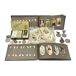  Quantity of cigarette cards and silks, some housed in albums, together with commemorative medallions etc