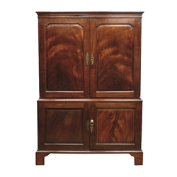  George II mahogany linen press, projecting cornice above two figured stepped ogee panelled doors, interior lined with damask fabric and fitted with hanging rail, panelled cupboard below, on bracket feet, W122cm, H178cm, D56cm  