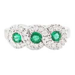 18ct white gold emerald and diamond triple cluster ring, three round cut emeralds, surroun...