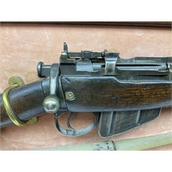 WW2 Lee Enfield No.4 Mk.1 .303 bolt-action rifle with hinged butt compartment, made by SA Ltd., Long Branch, Canada 1942, serial no.5L0646 L113cm; mounted on a framed display board with No.4 Mk.II spike bayonet, No.9 Mk.1 blade bayonet, two inert 5-round clips and brass biographical plaque by Antler Military Originals detailing DA Cert No.C3444 OLD STYLE DEACTIVATION SO FIREARMS CERTIFICATE REQUIRED OR RFD